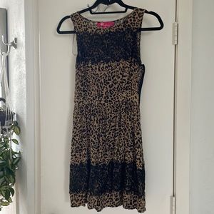 Boutique made, small batch only sold. Delicate lace overlay on Animal print